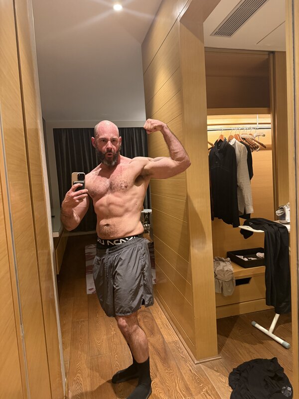 IMG_8404 — Front bicep flex, hotel room